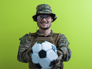 Image showing solder holding soccer  ball