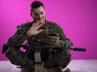 Image showing soldier using smartphone