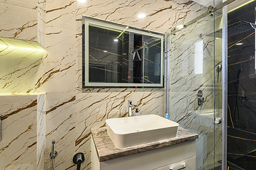 Image showing Spacious bathroom in black and white tones