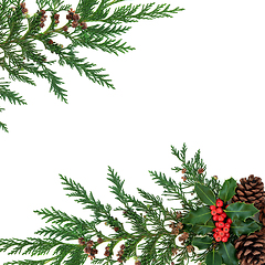 Image showing Winter Greenery Border with Holly Cedar & Pine Cones