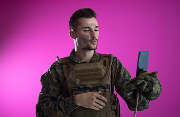 Image showing soldier using smartphone