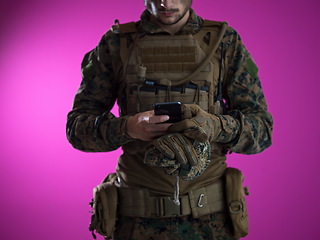 Image showing soldier using smartphone