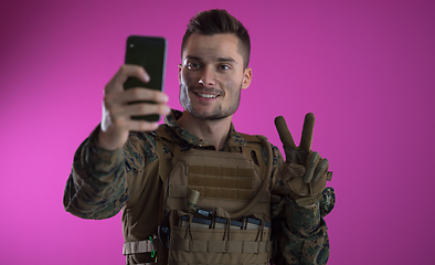 Image showing soldier using smartphone