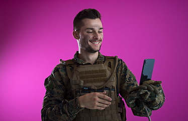 Image showing soldier using smartphone