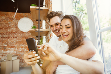 Image showing Young couple moved to a new house or apartment