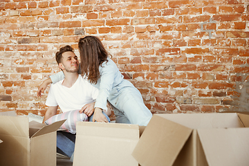 Image showing Young couple moved to a new house or apartment