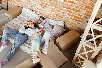 Image showing Young couple moved to a new house or apartment