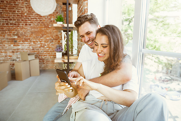 Image showing Young couple moved to a new house or apartment