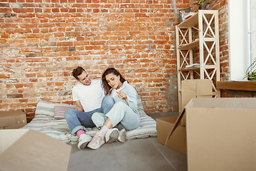 Image showing Young couple moved to a new house or apartment