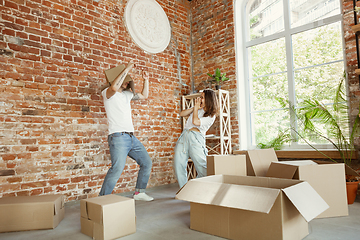 Image showing Young couple moved to a new house or apartment