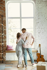 Image showing Young couple moved to a new house or apartment