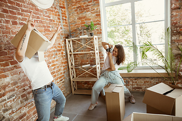 Image showing Young couple moved to a new house or apartment