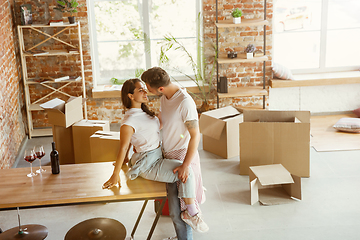 Image showing Young couple moved to a new house or apartment