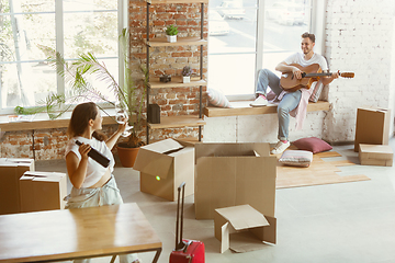 Image showing Young couple moved to a new house or apartment