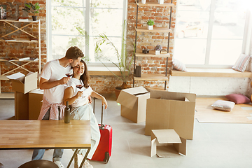 Image showing Young couple moved to a new house or apartment