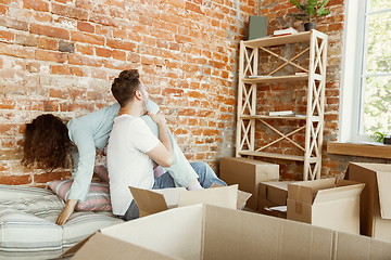 Image showing Young couple moved to a new house or apartment