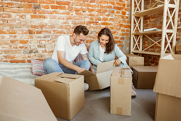 Image showing Young couple moved to a new house or apartment