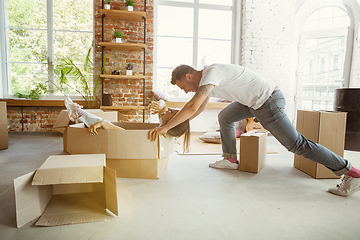 Image showing Young couple moved to a new house or apartment