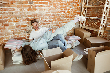 Image showing Young couple moved to a new house or apartment