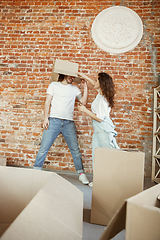 Image showing Young couple moved to a new house or apartment