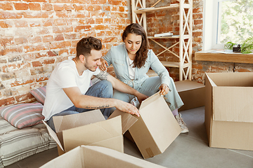 Image showing Young couple moved to a new house or apartment