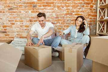 Image showing Young couple moved to a new house or apartment