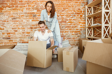 Image showing Young couple moved to a new house or apartment