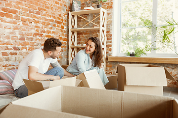 Image showing Young couple moved to a new house or apartment