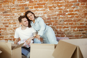 Image showing Young couple moved to a new house or apartment