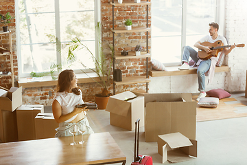 Image showing Young couple moved to a new house or apartment