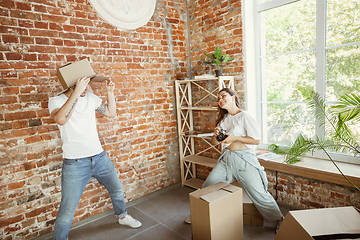 Image showing Young couple moved to a new house or apartment