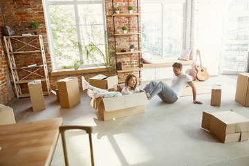 Image showing Young couple moved to a new house or apartment