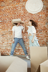 Image showing Young couple moved to a new house or apartment