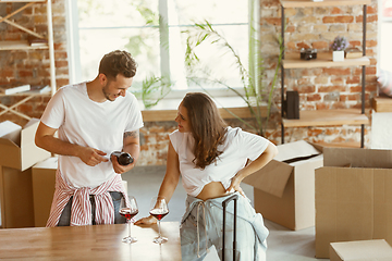 Image showing Young couple moved to a new house or apartment