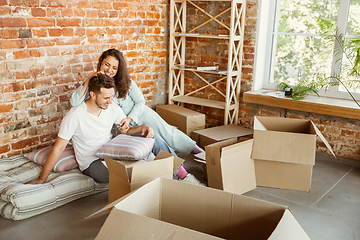 Image showing Young couple moved to a new house or apartment