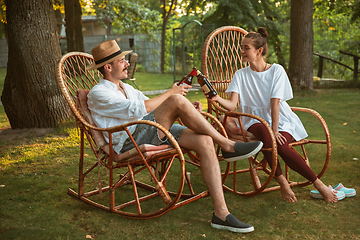 Image showing Happy couple at barbecue dinner on sunset time