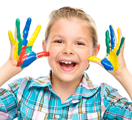 Image showing Portrait of a cute girl playing with paints