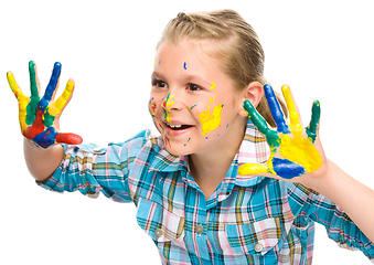 Image showing Portrait of a cute girl playing with paints