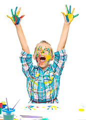 Image showing Little girl is rising her hands up in joy