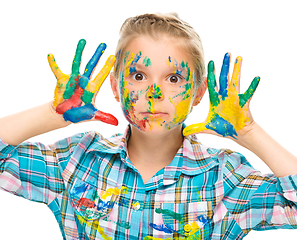 Image showing Portrait of a cute girl playing with paints