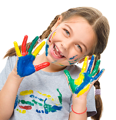 Image showing Portrait of a cute girl playing with paints