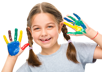 Image showing Portrait of a cute girl playing with paints