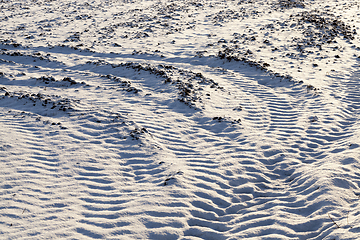 Image showing traces of the car wheels on snow