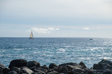 Image showing sail boat at horizon line