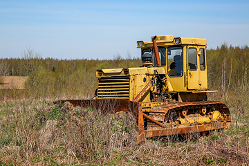 Image showing Old crawler tractor in the field.