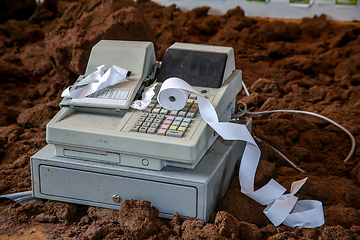 Image showing Old cash register with cash register tape. 