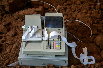 Image showing Old cash register with cash register tape. 