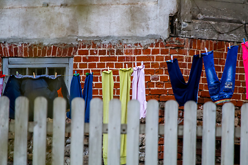 Image showing Colorful clothes laundry drying outdoor.