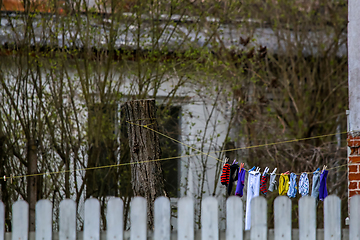 Image showing Colorful clothes laundry drying outdoor.