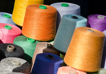 Image showing Colorful thread spools as background.